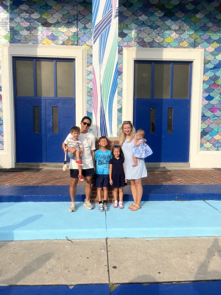 π Q3 2026 Update: Small Bets The family in front of a mermaid-scale mural