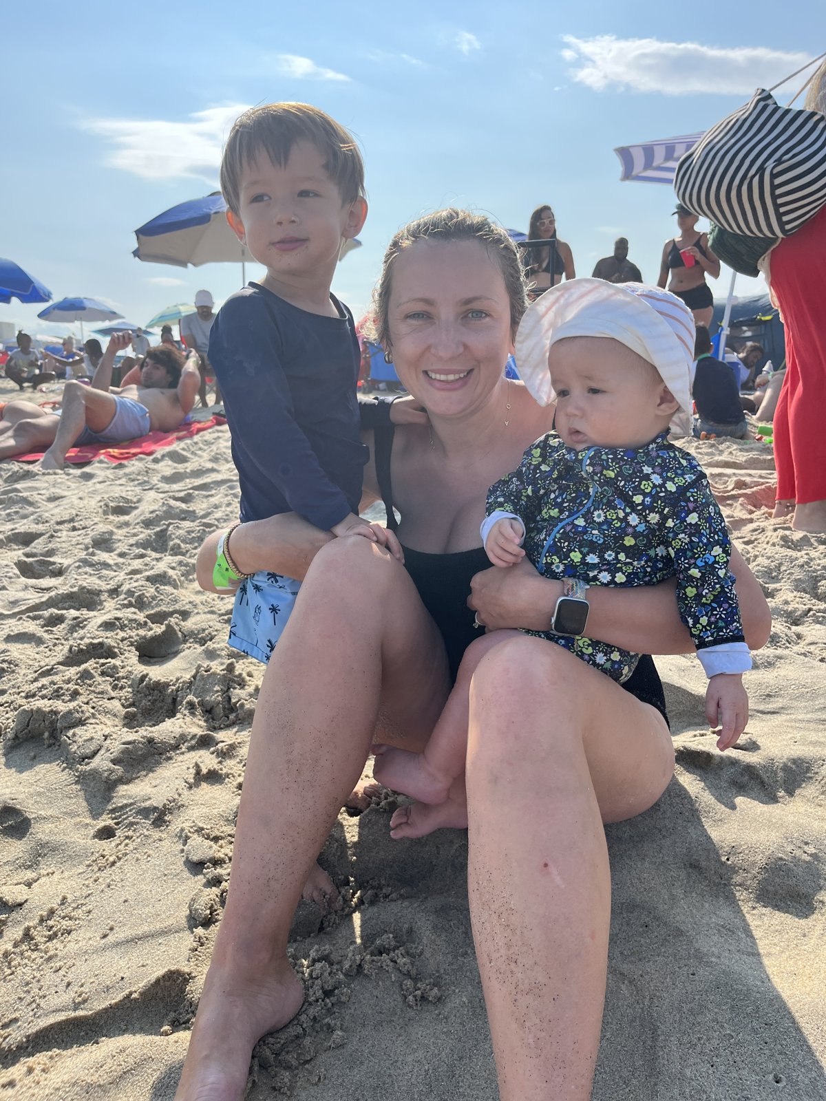 Amy with two of the kids on the beach